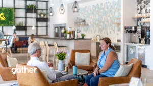 Two people sitting and chatting in a shared coworking area at Gather Short Pump